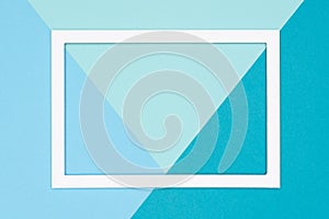 Abstract geometrical flat lay pastel blue and turquoise colored paper background. Minimalism, geometry and symmetry template.