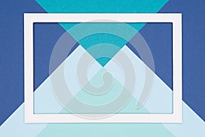 Abstract geometrical flat lay pastel blue and turquoise colored paper background. Minimalism, geometry and symmetry template.