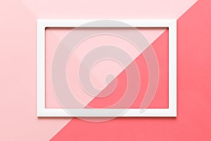 Abstract geometrical living coral and pastel pink paper flat lay background. Minimalism, geometry and symmetry template.