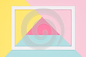 Abstract geometrical pastel blue, pink and yellow paper flat lay background. Minimalism, geometry and symmetry template.