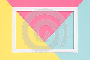 Abstract geometrical pastel blue, pink and yellow paper flat lay background. Minimalism, geometry and symmetry template.