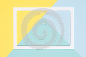 Abstract geometrical pastel blue, teal and yellow paper flat lay background. Minimalism, geometry and symmetry template.