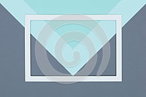 Abstract geometrical pastel blue, turquoise and grey colored paper flat lay background. Minimalism, geometry and symmetry template