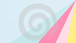 Abstract geometrical pastel blue, yellow and pink paper flat lay background. Minimalism and symmetry template.