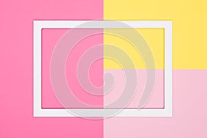 Abstract geometrical pastel pink and yellow paper flat lay background. Minimalism, geometry and symmetry template with empty frame