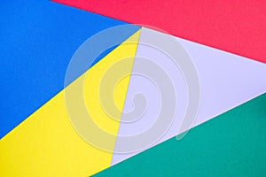 Abstract geometrical pattern made from green, violet, blue, red and yellow paper, blank background for template, horizontal,  copy