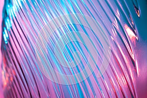 Abstract glass background. Texture of wavy glass illuminated with multi-colored light. Pink and blue stains. glass