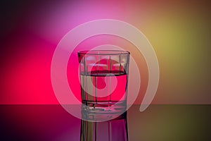 Abstract glass with liquid on multicolor background