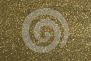 Sparkly glitter, dark golden background bokeh effect