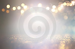 Abstract glitter silver and gild lights background. de-focused photo