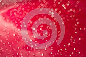 Abstract glittering red bokeh background