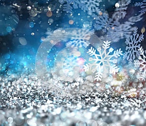 Abstract glowing Christmas blue background with snowflakes