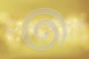 Abstract gold color background with bokeh light.