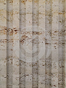 Abstract gold color painted on grunge rough surface of stucco concrete wall. Golden texture background and wallpaper