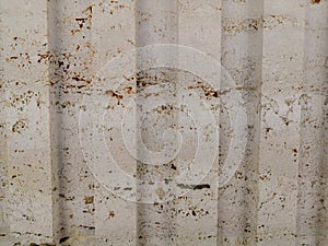 Abstract gold color painted on grunge rough surface of stucco concrete wall. Golden texture background and wallpaper