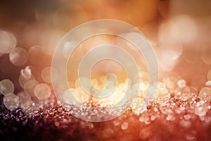 Abstract gold copper glittering bokeh background