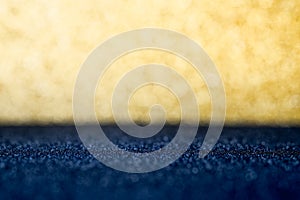 Abstract gold and dark blue sparkling bokeh wall and floor background studio.luxury holiday backdrop mock up for display