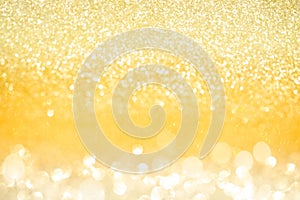 Abstract gold glitter bokeh lights with soft light background