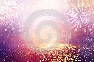Abstract gold, purple and silver glitter background with fireworks. christmas eve, 4th of july holiday concept
