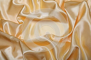 Abstract gold silk fabric background
