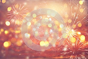 Abstract gold and silver glitter background with fireworks. christmas eve, 4th of july holiday concept.
