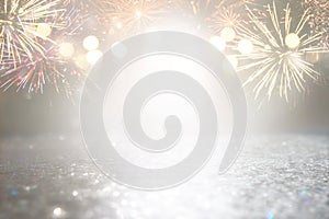 Abstract gold and silver glitter background with fireworks. christmas eve, 4th of july holiday concept