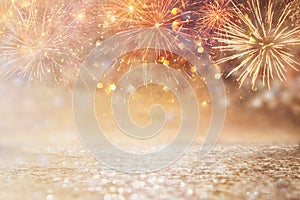 Abstract gold and silver glitter background with fireworks. christmas eve, 4th of july holiday concept