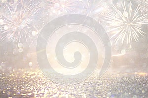 Abstract gold and silver glitter background with fireworks. christmas eve, 4th of july holiday concept