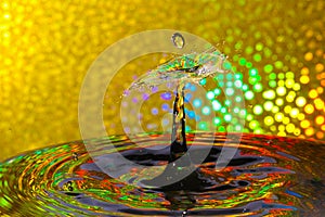 Abstract gold water drop collision