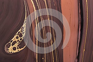 Abstract Golden curl on brown waves. Acrylic Fluid Art. Art Deco marbling background or texture