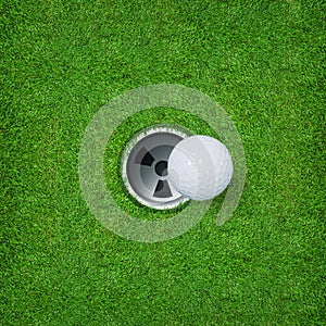 Abstract golf sport background of golf ball and golf hole on green grass background.