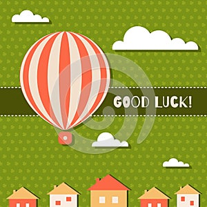 Abstract Good Luck Card With Hot Air Balloon, Clouds, Houses And Three Leaf Clovers Pattern Background