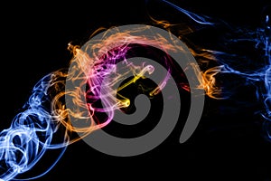 Abstract colored smoke isolated on a black.