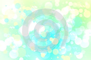 Abstract gradient light blue turquoise yellow green shiny blurred background texture with circular bokeh lights. Beautiful fresh