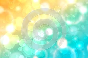 Abstract gradient light blue turquoise yellow green shiny blurred background texture with circular bokeh lights. Beautiful fresh