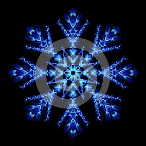 Abstract graphic design element snowflake on black background