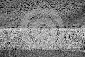 Abstract gray background of asphalt, road and curb from above