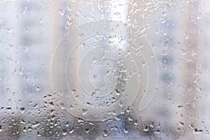 Abstract gray background of raindrops on glass