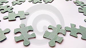 Abstract gray jigsaw puzzle pieces on white background