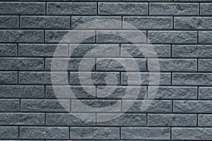 Abstract gray pattern of brick wall background. Light grey stone background. Grey bricks texture wallpaper backdrop of house facad