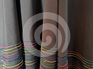 Abstract gray textured hijab fabric background with a combination of colored stripes