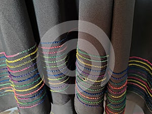 Abstract gray textured hijab fabric background with a combination of colored stripes