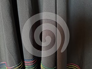 Abstract gray textured hijab fabric background with a combination of colored stripes