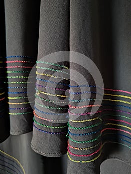 Abstract gray textured hijab fabric background with a combination of colored stripes