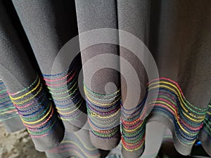 Abstract gray textured hijab fabric background with a combination of colored stripes