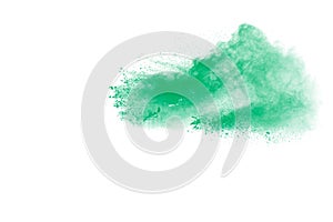 Abstract green dust explosion on white background.