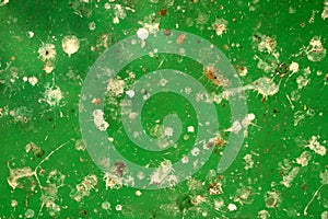 Abstract green metal surface with white patches photo