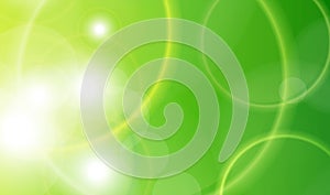 Abstract green sunny background, circle bokeh pattern over green back