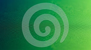 Abstract green textured surface with subtle light and shadow effect background emerald