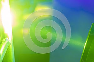 Abstract green and yellow background in blue spotlight